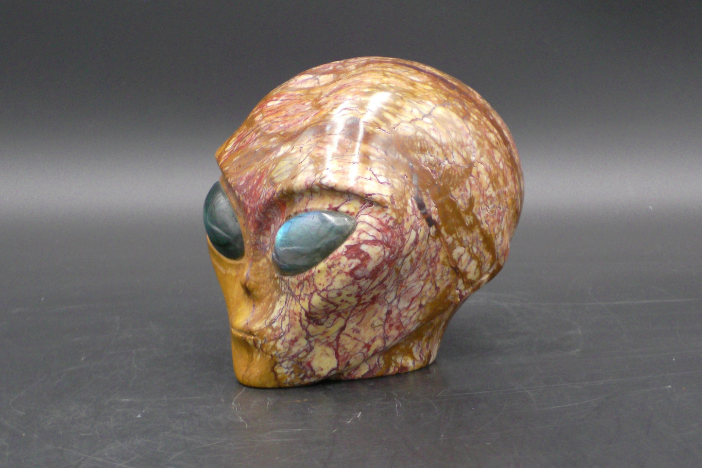 Beautiful Brecciated Jasper Alien Skull with Labradorite Eyes - 1223 g. - Size: 100 mm