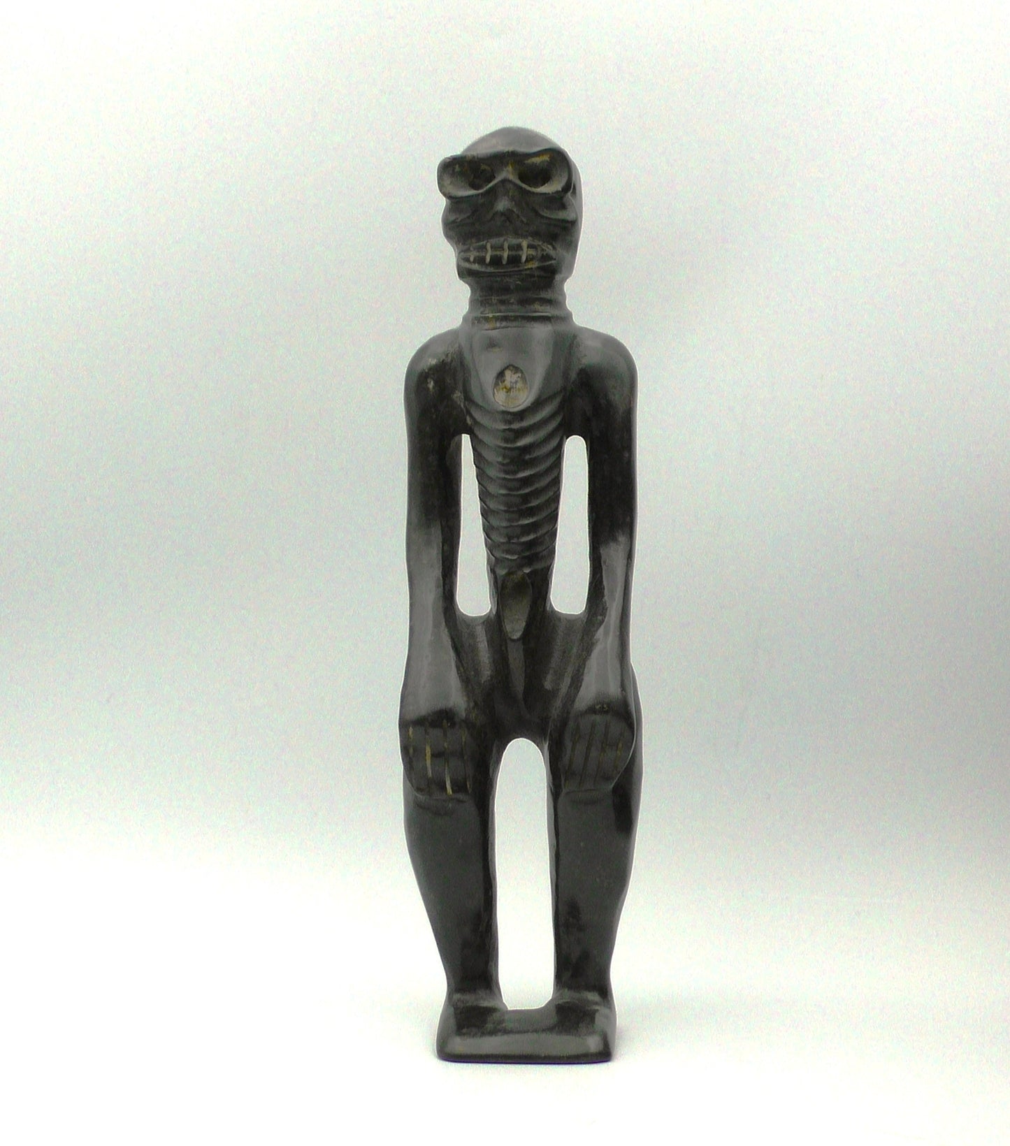 BLACK IRON METEORITE SKELETON FIGURE