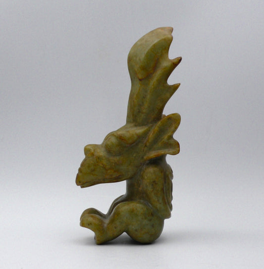 EXTRAORDINARY SEATED NEPHRITE JADE FIGURE